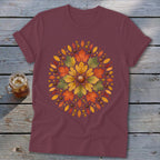 Burgundy t-shirt with a circular autumn leaf and acorn mandala design.