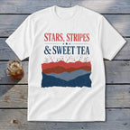 A white t-shirt featuring the text "STARS, STRIPES & SWEET TEA" above a red, white, and blue mountain graphic.