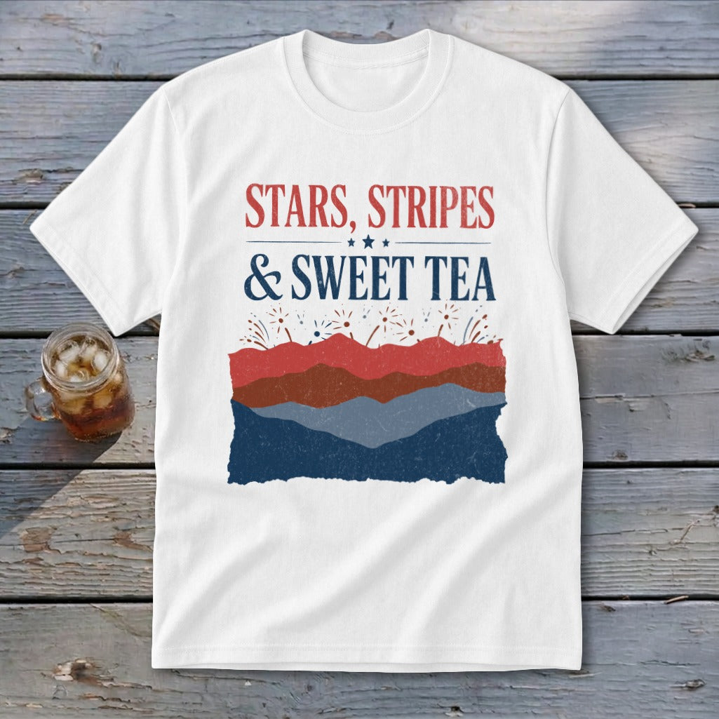 A white t-shirt featuring the text "STARS, STRIPES & SWEET TEA" above a red, white, and blue mountain graphic.