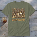 Olive green t-shirt with "Mountain Gold Morel Harvest" text and mushroom illustration.