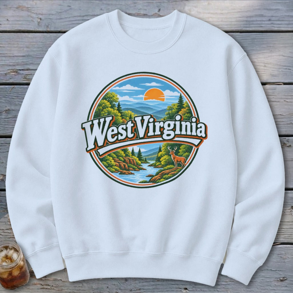 White sweatshirt with a circular graphic depicting a West Virginia landscape with mountains, river, trees, and a deer.
