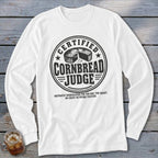 White long-sleeve shirt with a black graphic that reads Certified Cornbread Judge surrounding a cornbread illustration.