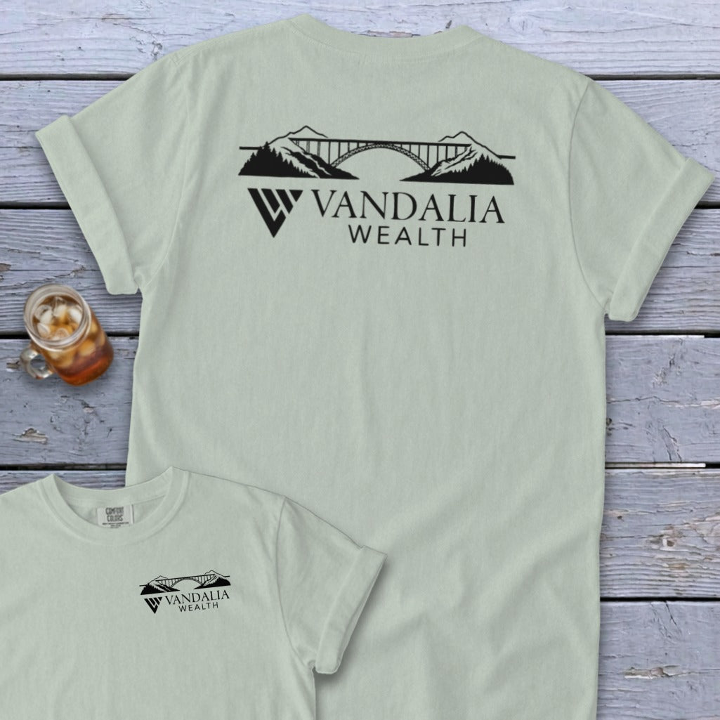 Light green t-shirt with a black Vandalia Wealth bridge logo design.