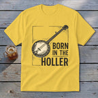Yellow t-shirt with banjo graphic and text "BORN IN THE HOLLER".
