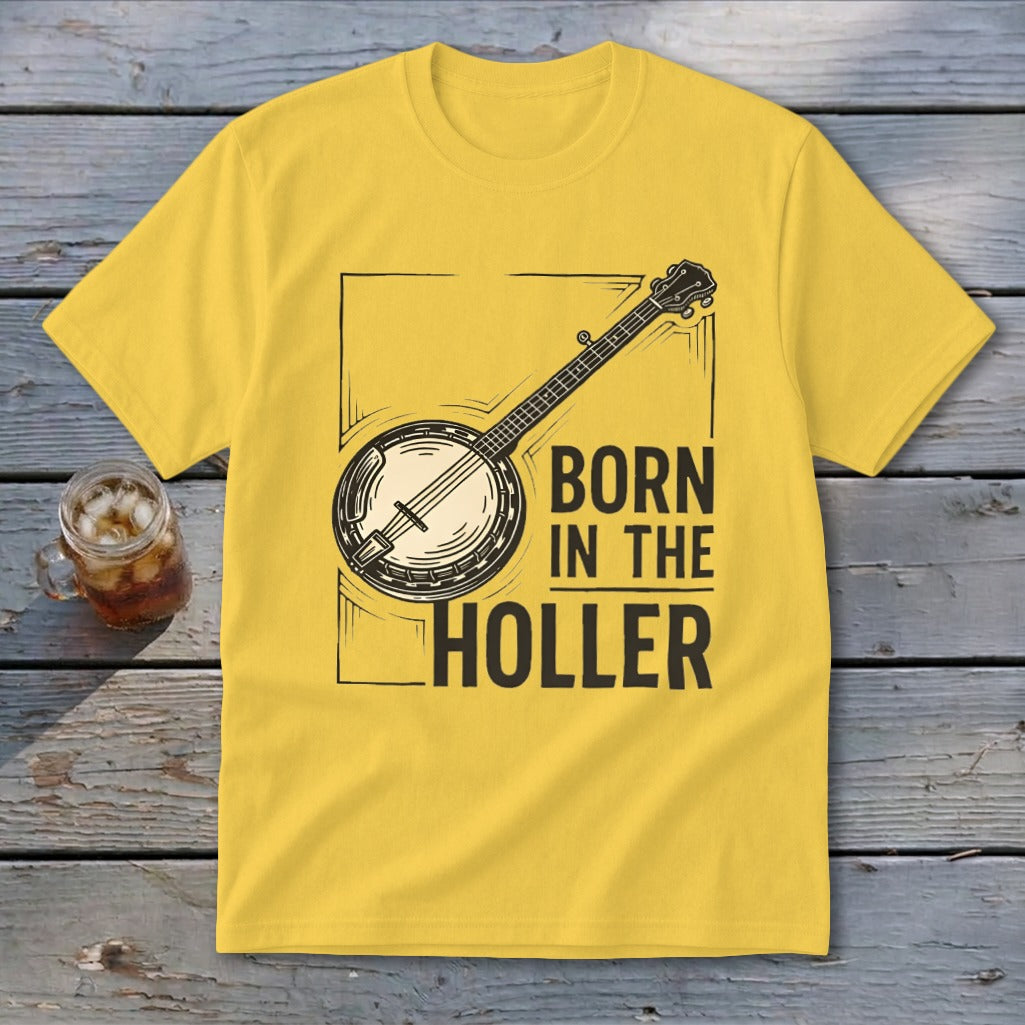 Yellow t-shirt with banjo graphic and text "BORN IN THE HOLLER".