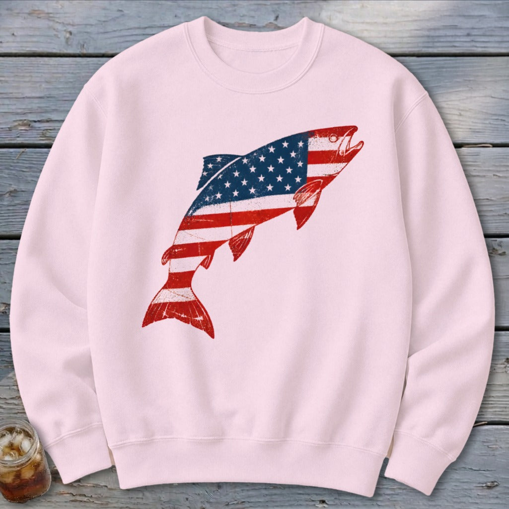 Light pink crewneck sweatshirt with a large leaping fish graphic filled with an American flag pattern.