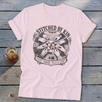 T-shirt with "STITCHED BY KIN" and "EVERY SQUARE TELLS A STORY" text.
