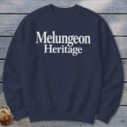 Navy blue crewneck sweatshirt with the white text Melungeon Heritage centered on the chest.