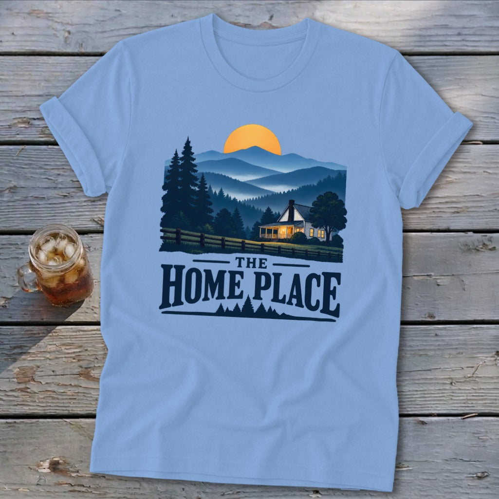 Light blue t-shirt with a landscape featuring a house and "The Home Place" text.