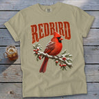 Light olive green t-shirt with a vintage red cardinal and berry branch graphic, featuring the text REDBIRD.