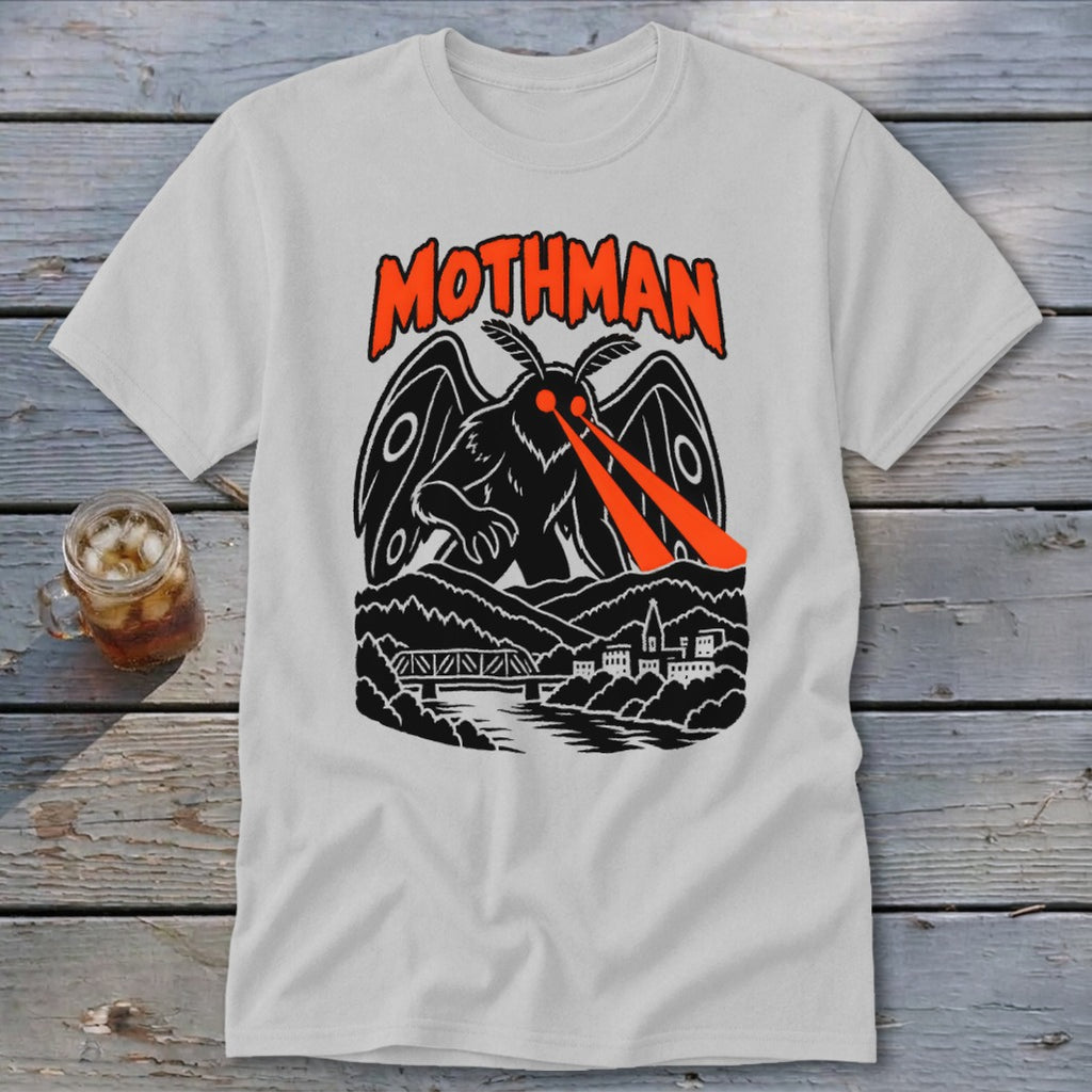 White t-shirt with Mothman graphic, featuring text "MOTHMAN" and creature with red laser eyes.