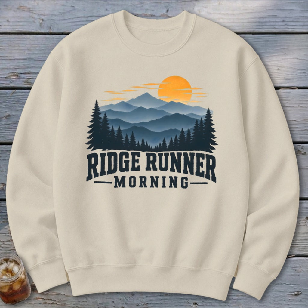 Cream sweatshirt with "Ridge Runner Morning" text and mountain landscape graphic.