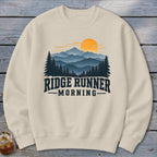 Cream sweatshirt with "Ridge Runner Morning" text and mountain landscape graphic.
