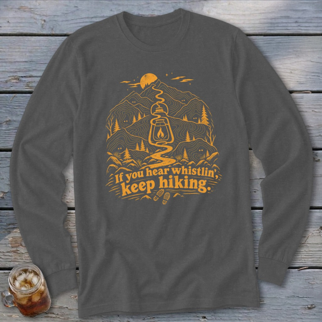 Long sleeve shirt with orange hiking graphic and text.