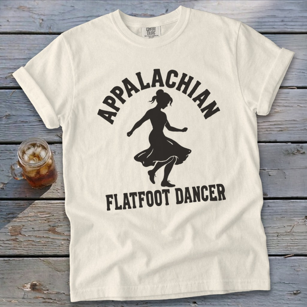 Off-white t-shirt with black graphic of a dancing woman and text reading Appalachian Flatfoot Dancer.