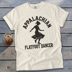 Off-white t-shirt with black graphic of a dancing woman and text reading Appalachian Flatfoot Dancer.