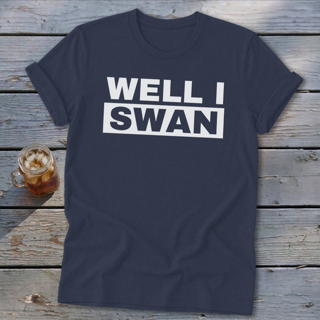 Dark blue t-shirt featuring the white text Well I Swan laid out over two lines.