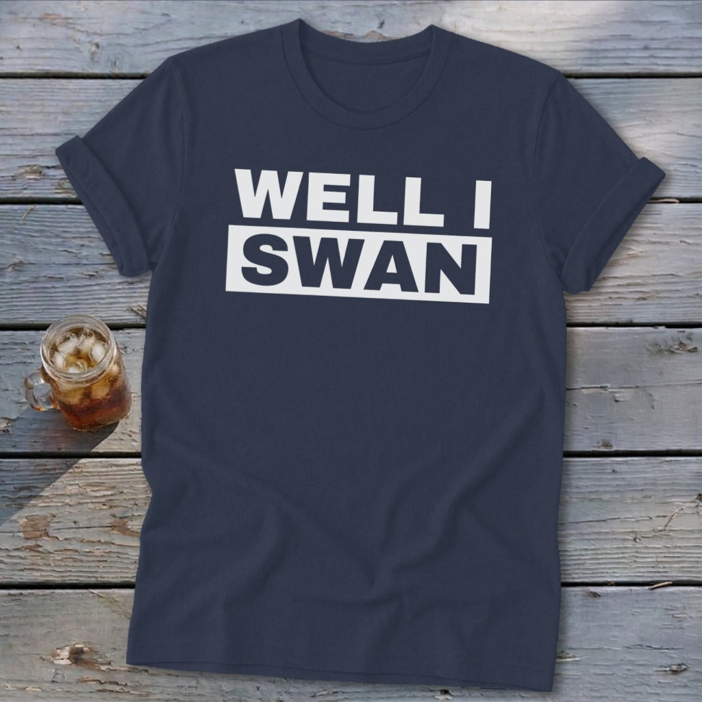 Dark blue t-shirt featuring the white text Well I Swan laid out over two lines.