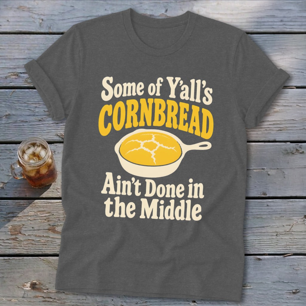 Dark gray t-shirt featuring yellow and white text and a skillet of cornbread graphic.