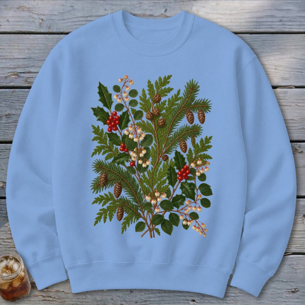 Light blue crewneck sweatshirt with a detailed evergreen and holly botanical print.
