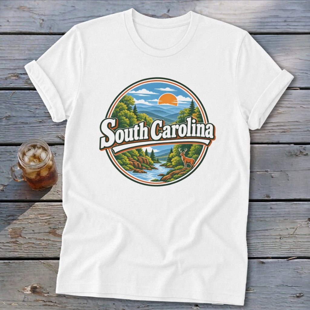 White t-shirt with circular graphic of South Carolina mountains, river, deer, and sunset.