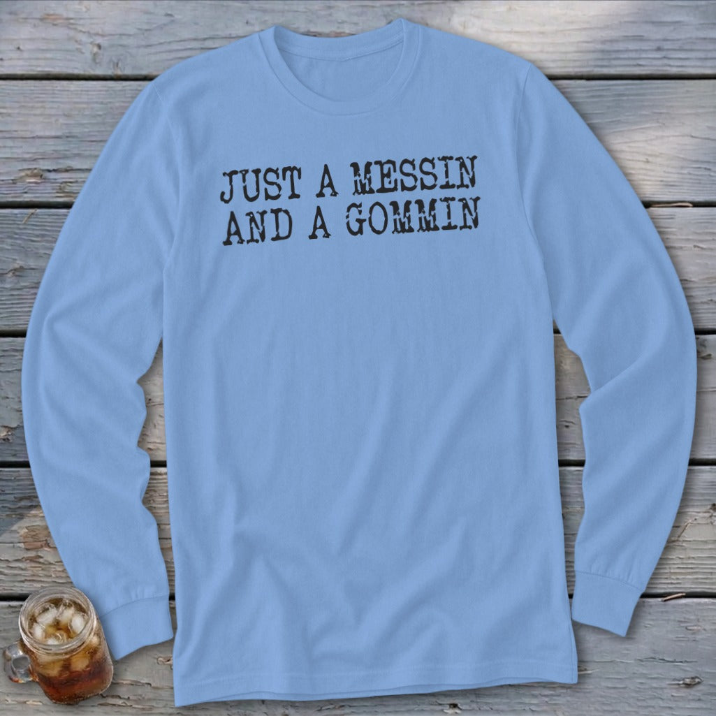 Light blue long-sleeve t-shirt with black text that reads "JUST A MESSIN AND A GOMMIN".