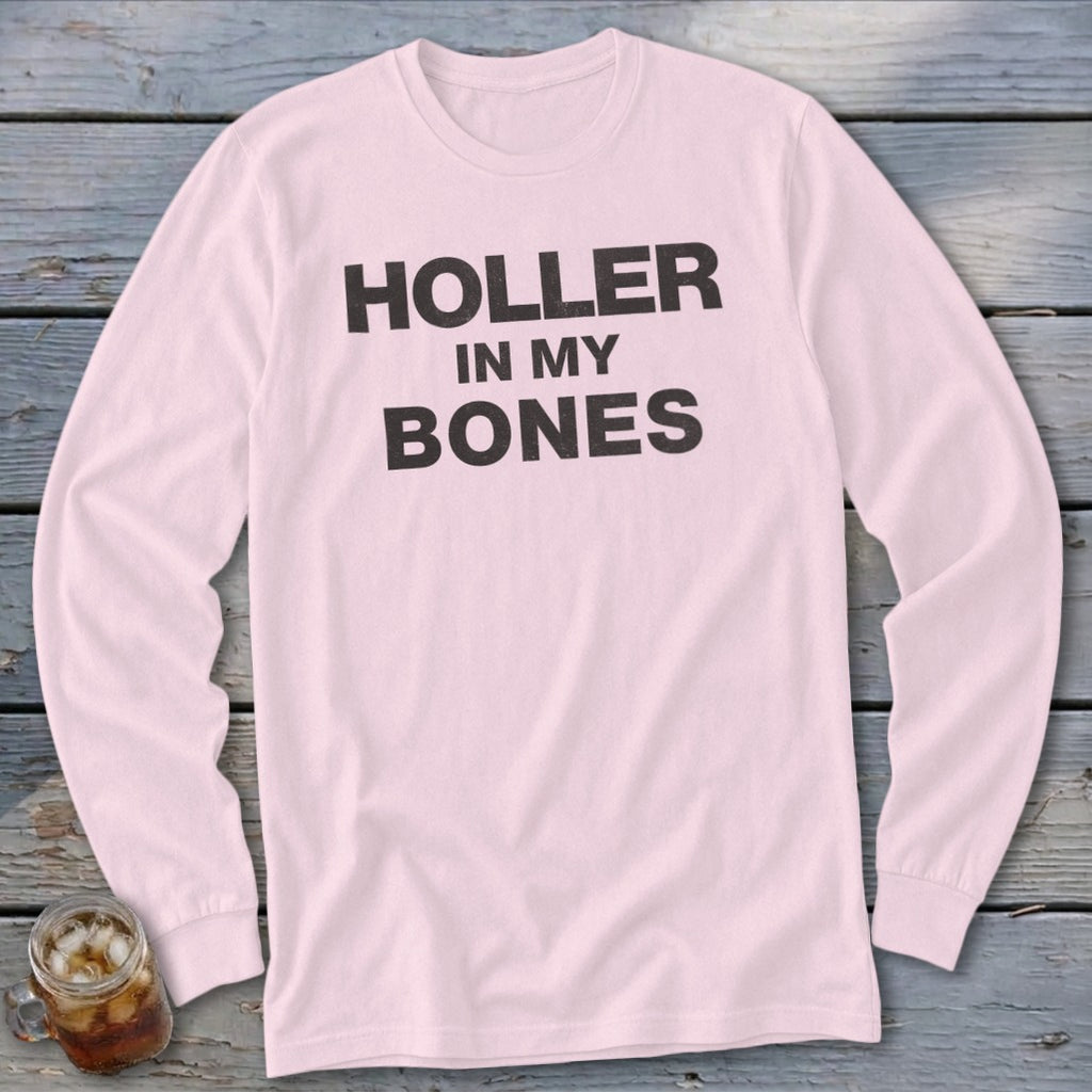 Pink long sleeve t-shirt with black text reading "HOLLER IN MY BONES".