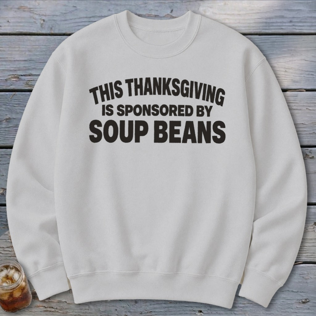 A light gray sweatshirt printed with black text reading THIS THANKSGIVING IS SPONSORED BY SOUP BEANS.