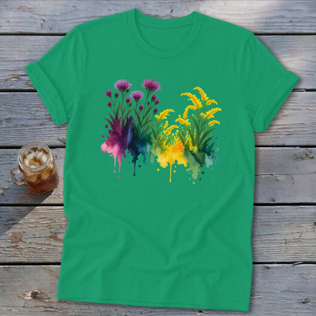 Green t-shirt with watercolor painting of purple and yellow flowers with abstract splashes.