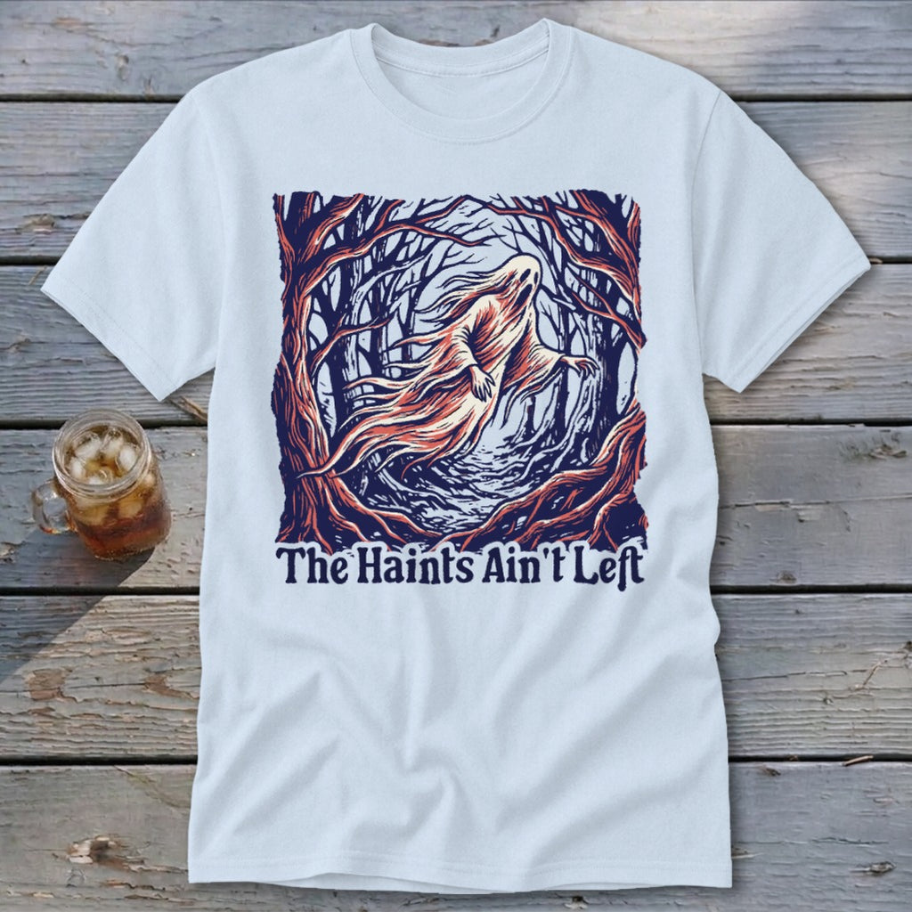 White t-shirt with a ghost in a spooky forest and text "The Haints Ain't Left".