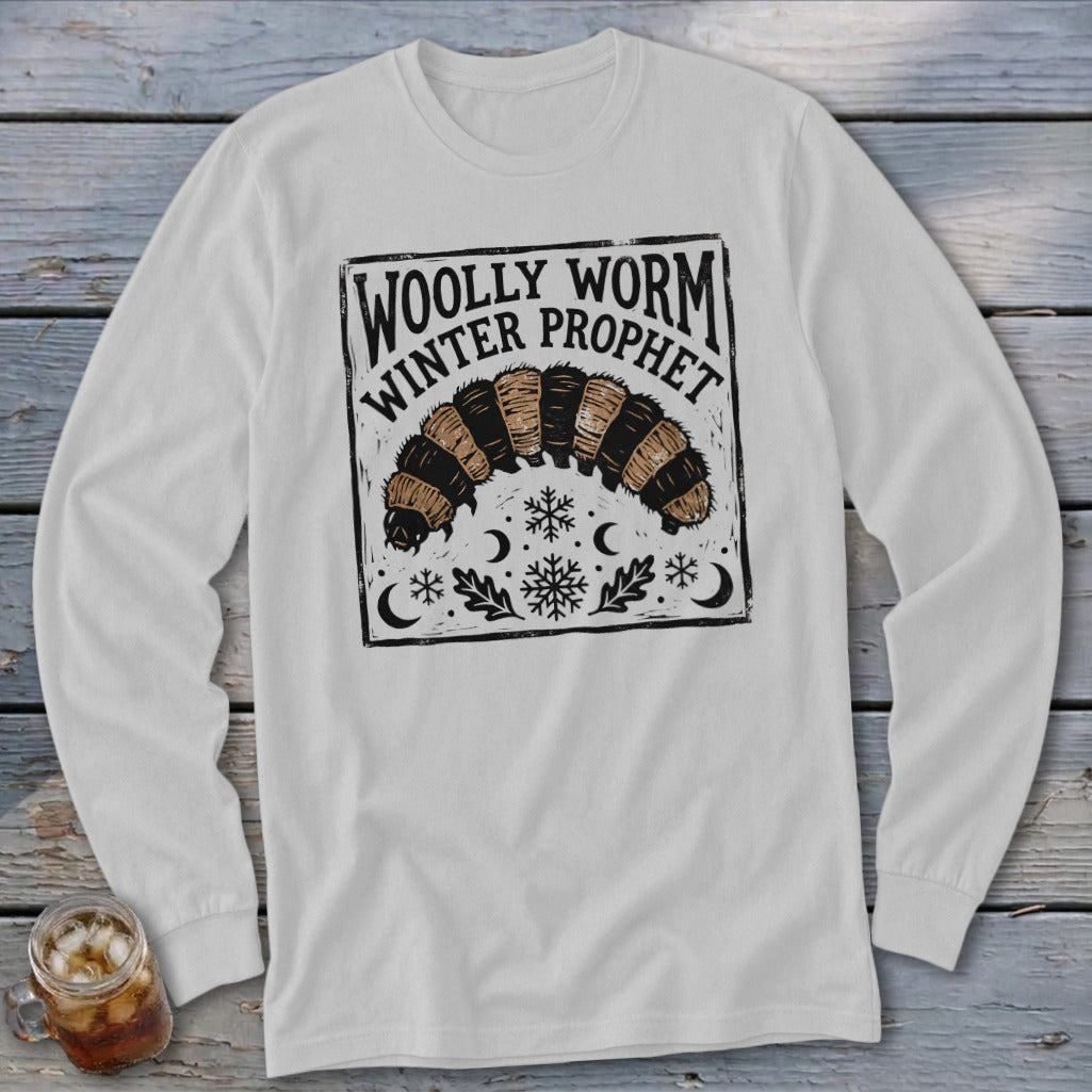 Light gray long-sleeve t-shirt with a vintage-style black graphic of a woolly worm and text reading Woolly Worm Winter Prophet.