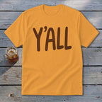 Orange t-shirt with brown "Y'ALL" text and a glass of iced tea.