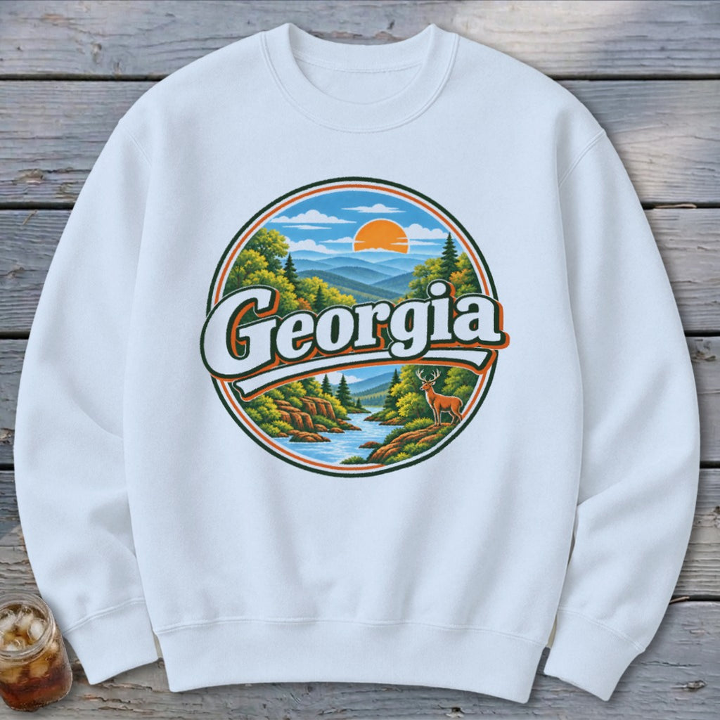 White sweatshirt with a circular graphic of a Georgia landscape with a deer.