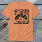 An orange t-shirt featuring a black graphic of a woolly worm, snowflakes, and the text Woolly Worm Winter Prophet.