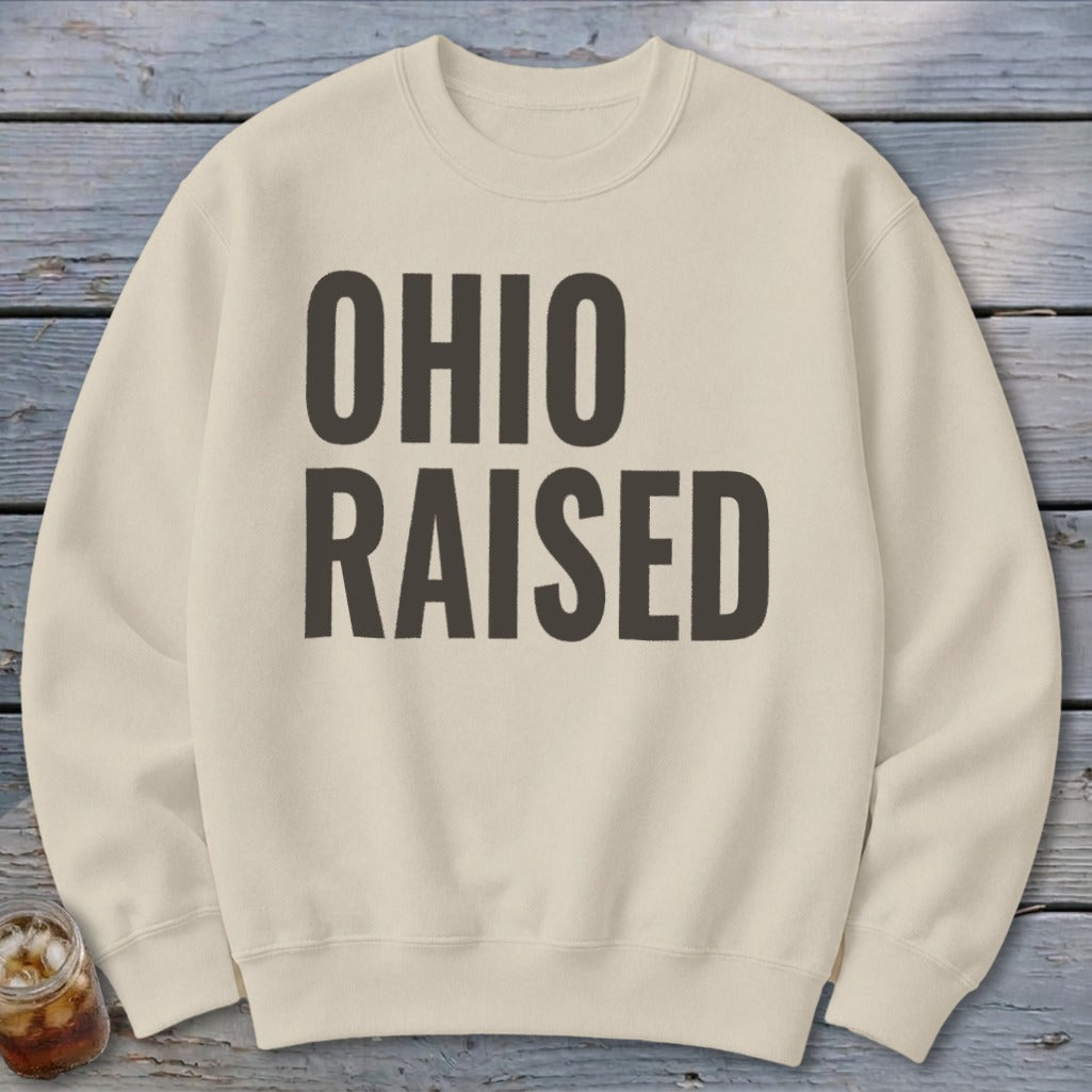 Cream sweatshirt with bold dark gray text reading "OHIO RAISED".