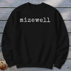 Black sweatshirt with white "mizewell" text in typewriter font.