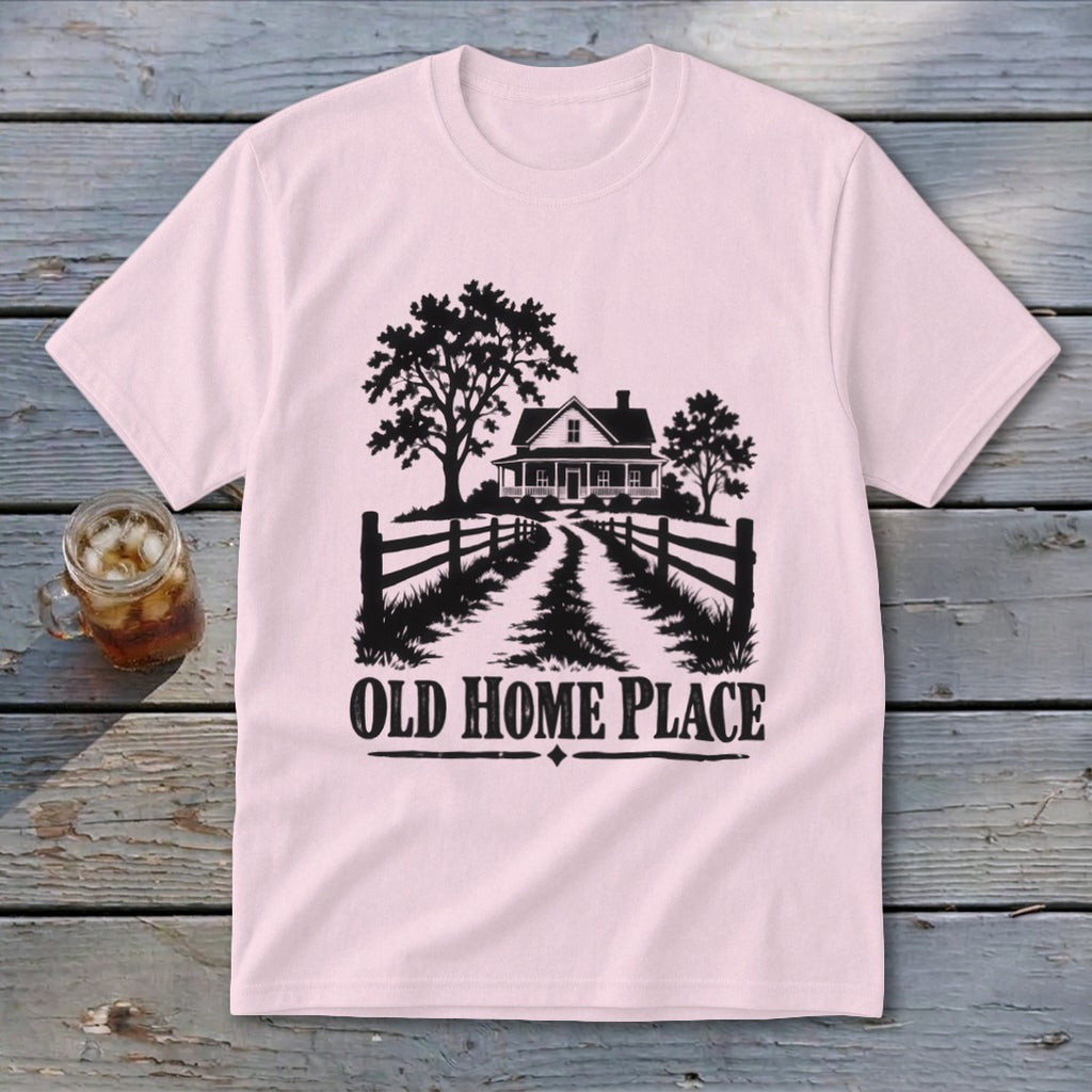 Pink t-shirt with black graphic of a farmhouse, trees, fence, and text "OLD HOME PLACE".