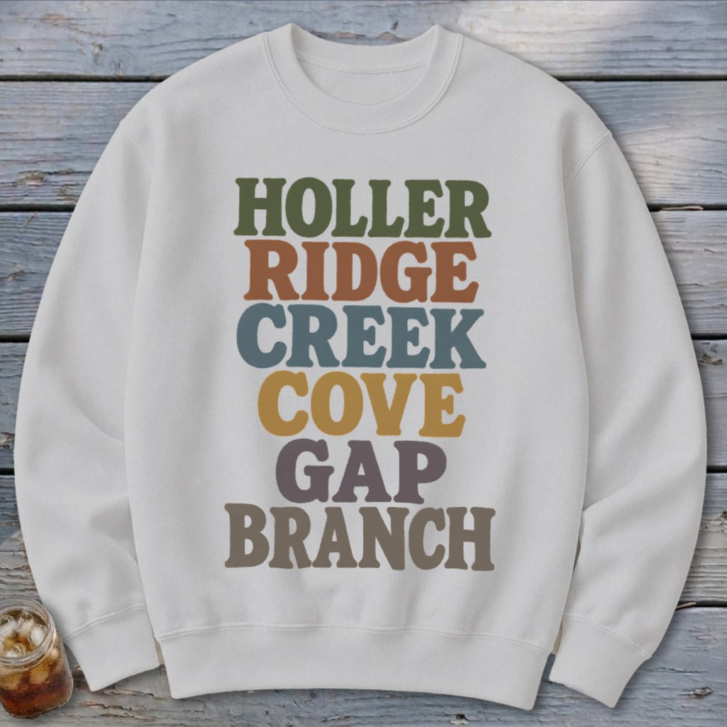 Light gray crewneck sweatshirt printed with stacked text reading HOLLER RIDGE CREEK COVE GAP BRANCH.