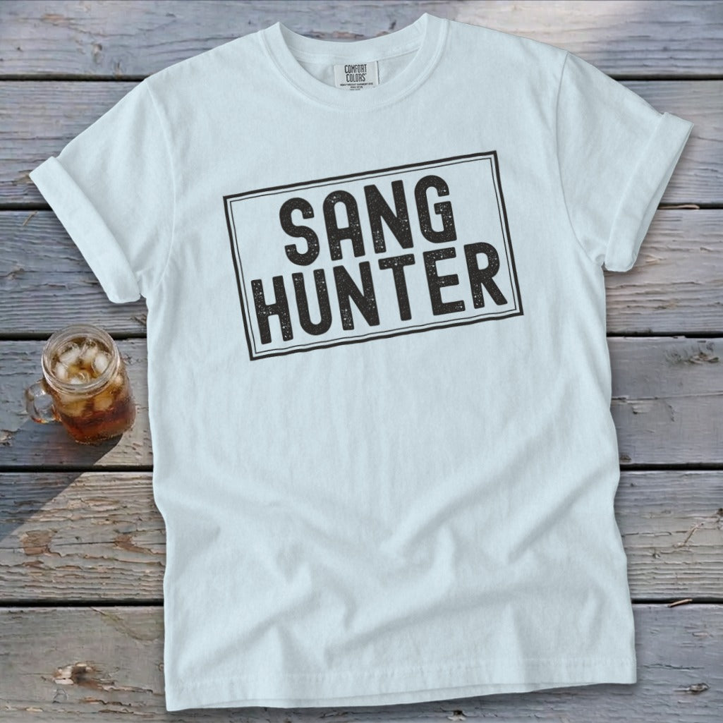 White t-shirt with "SANG HUNTER" printed in a black rectangle.