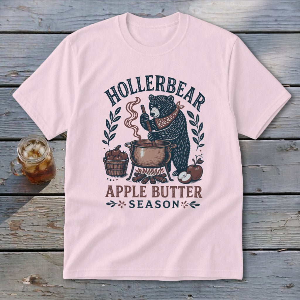 Pink t-shirt with bear making apple butter graphic and text "HOLLERBEAR APPLE BUTTER SEASON".