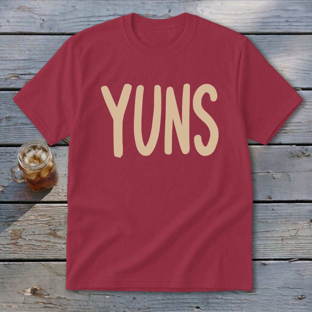 Maroon t-shirt with beige "YUNS" text and glass of iced drink.