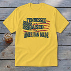 Yellow t-shirt with "Tennessee Raised American Made" text and American flag graphic.