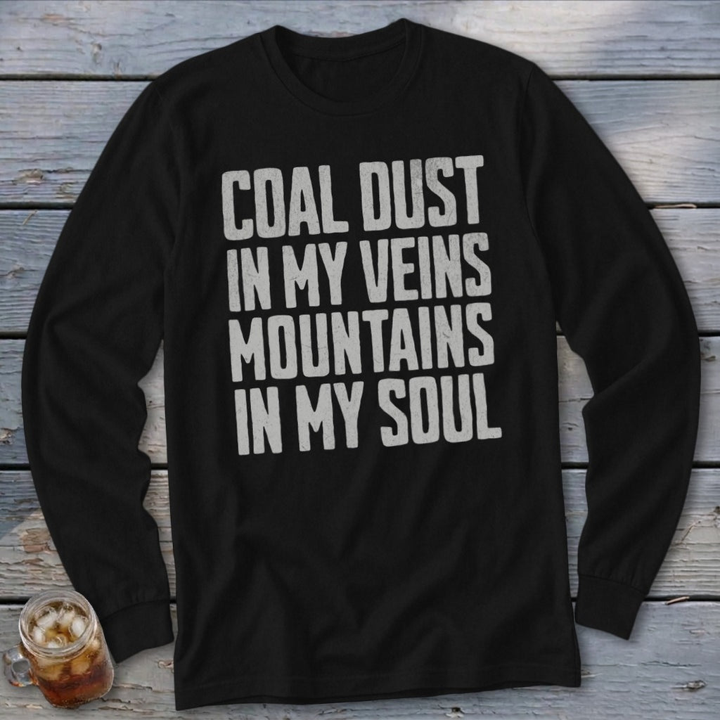 A black long-sleeve shirt with the distressed gray text Coal Dust In My Veins Mountains In My Soul.