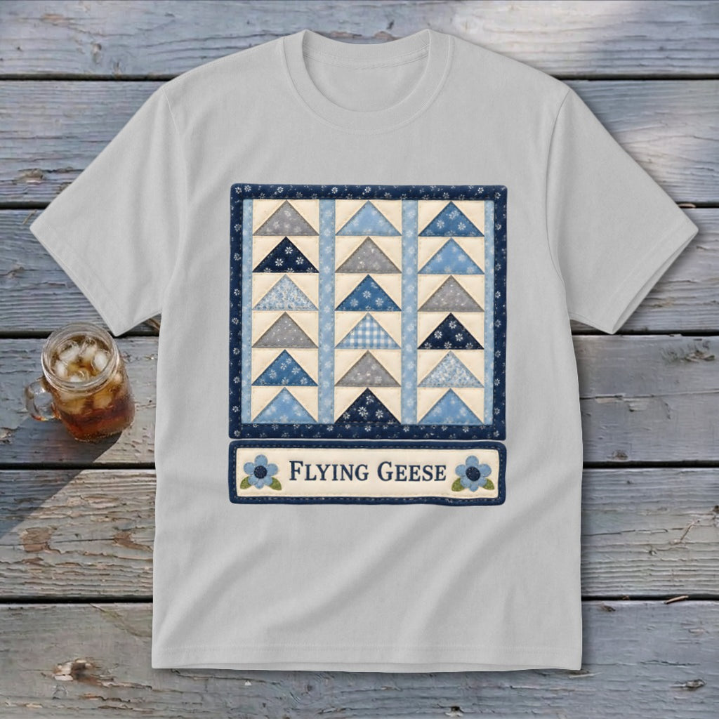 White t-shirt with a blue and gray flying geese quilt pattern and "Flying Geese" text.