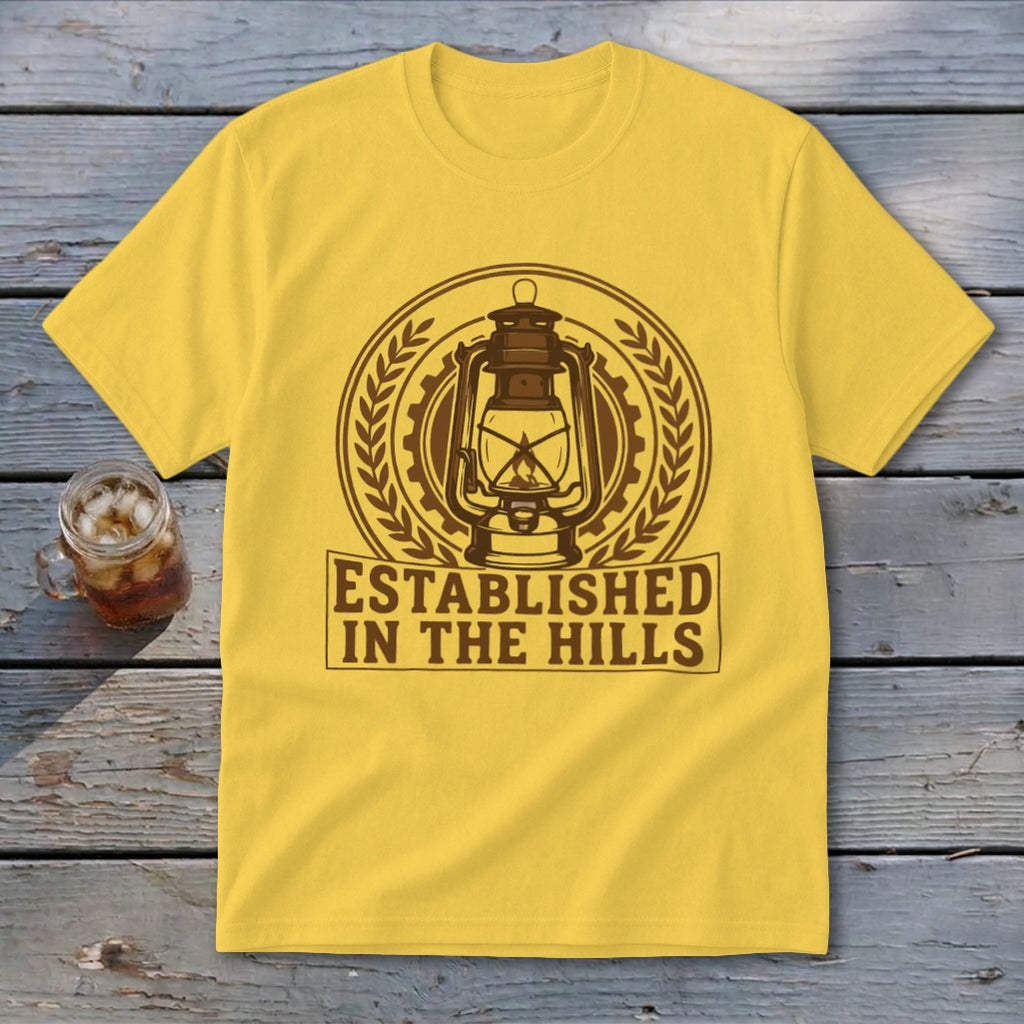 Yellow t-shirt with a brown lantern emblem and text "ESTABLISHED IN THE HILLS".