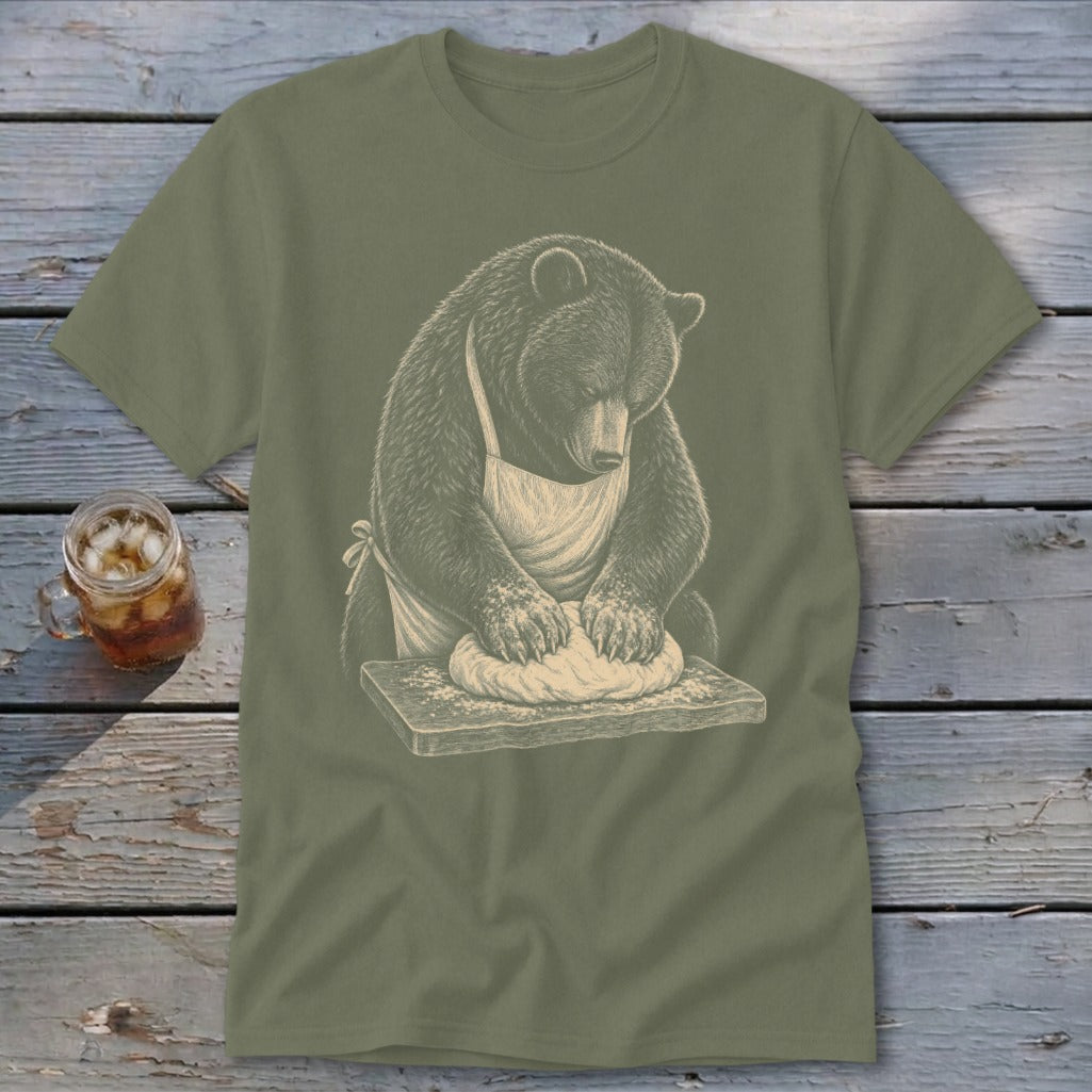 Bear wearing an apron kneading dough on a wooden cutting board.
