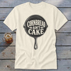 Cream t-shirt with cast iron skillet graphic saying "Cornbread Ain't Cake".