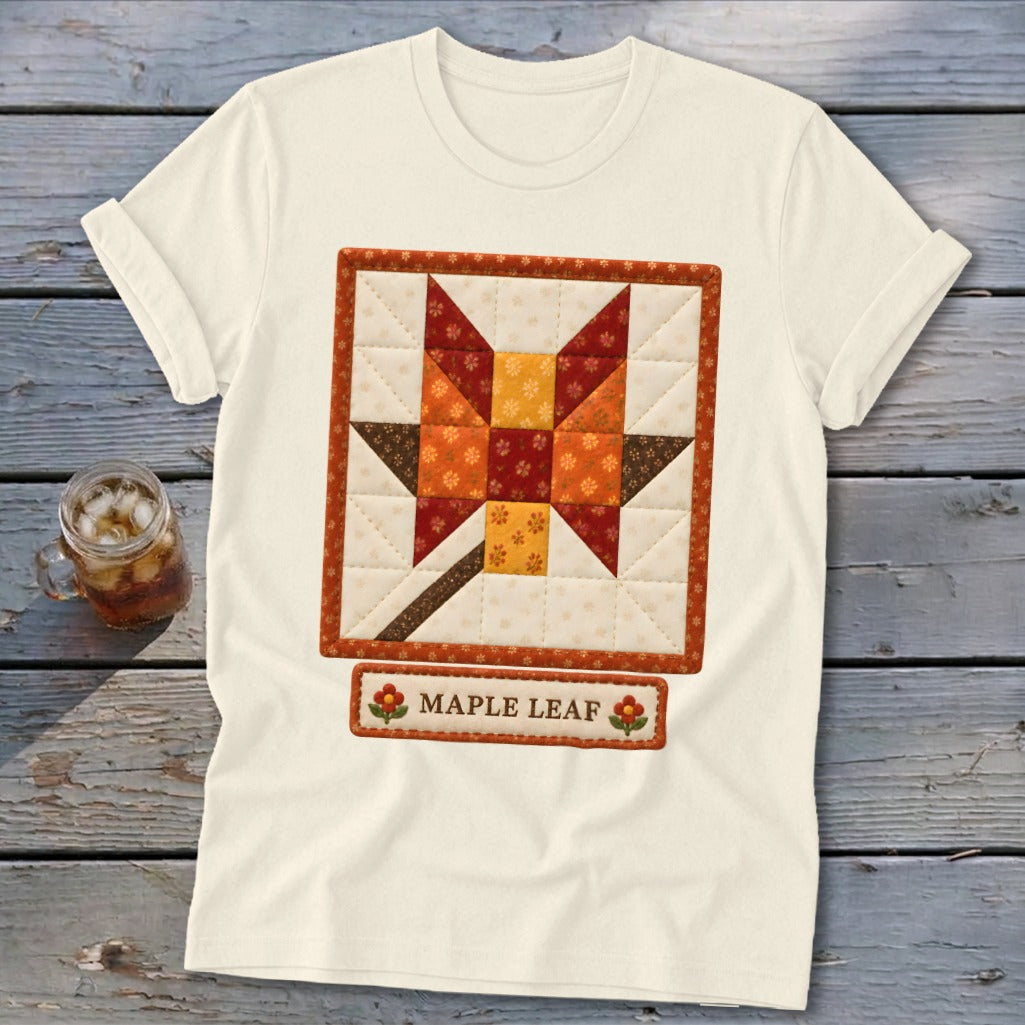 Cream t-shirt with a quilted maple leaf design and "Maple Leaf" text.