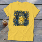 Yellow t-shirt with a graphic of fireflies in a mason jar at night.