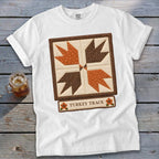 White t-shirt with a quilt block design featuring turkey tracks and "Turkey Track" text.